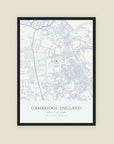 Personalised map print, Minimal, in a black frame, portrait, with a pale grey street map of central Cambridge, a coral pin and the title Cambridge, England.