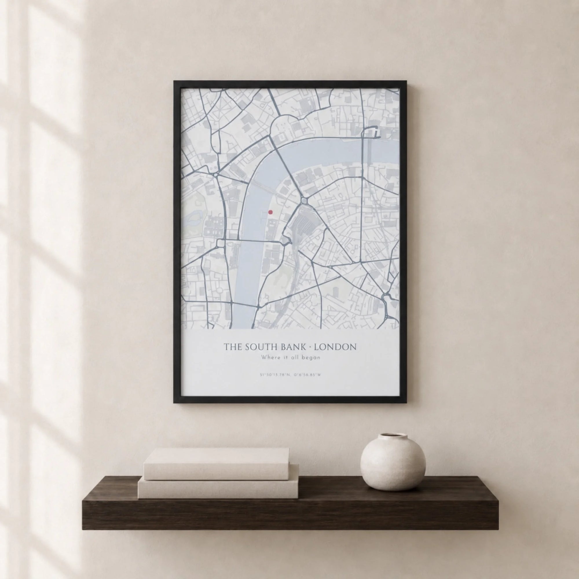 Personalised minimal map print in cool blue-grey tones with a location pin, printed on archival matt paper and displayed as wall art