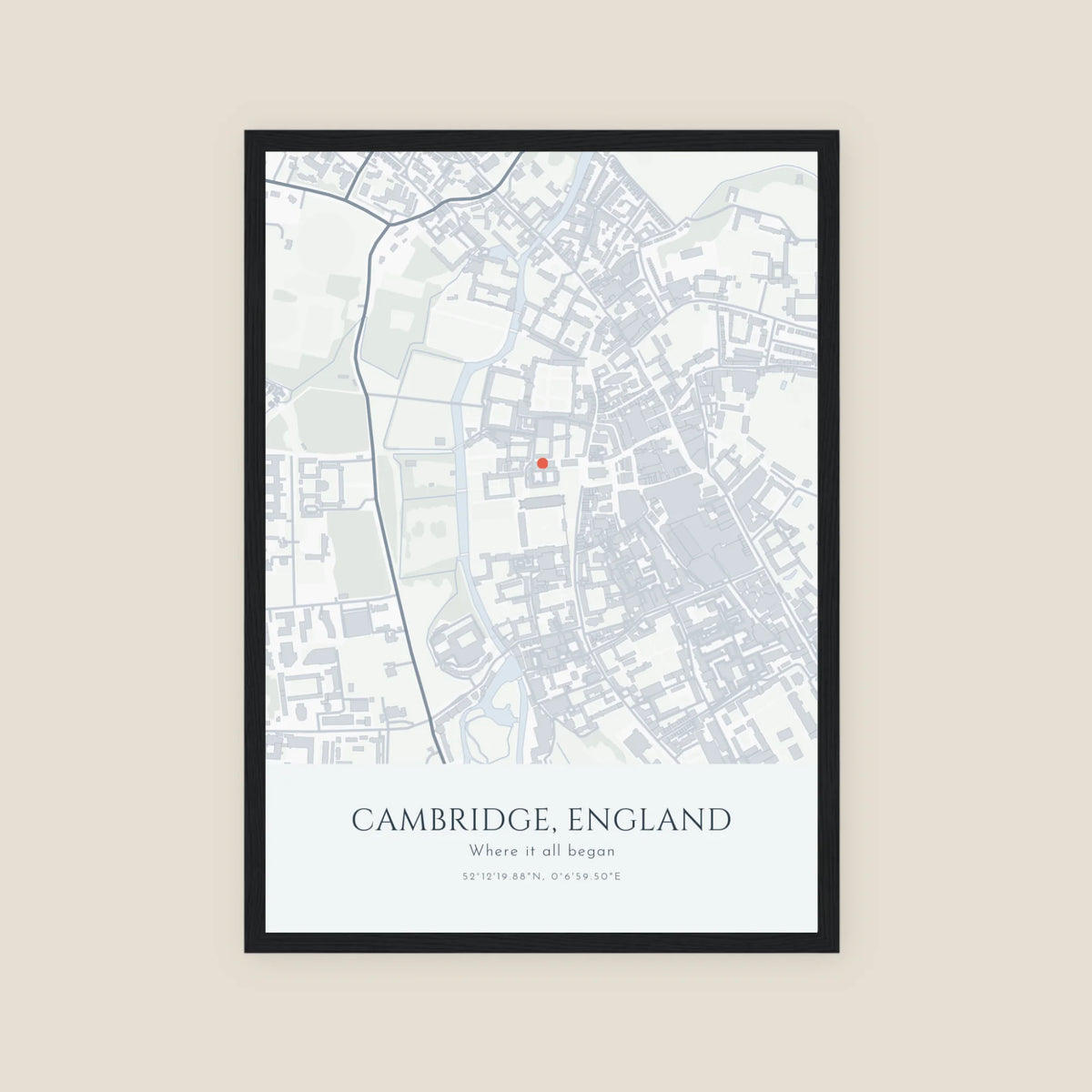 Personalised map print, Minimal, in a black frame, portrait, with a pale grey street map of central Cambridge, a coral pin and the title Cambridge, England.