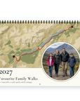 Front cover of the Personalised Route & Photo Calendar 2027 — Routes & Photos: a red route traced along Loch Laggan on a golden hill-shaded map of the Scottish Highlands, a round photo of a family of four walking a mountain path, and the caption “2027, Favourite Family Walks – It is impossible to walk rapidly and be unhappy”